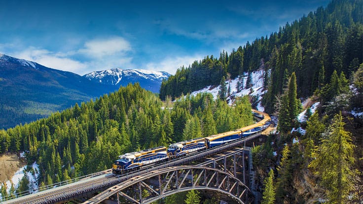 Journey on the Rocky Mountaineer  through the rugged terrain of the Canadian Rockies with a pre or post cruise land program to the Great Land.