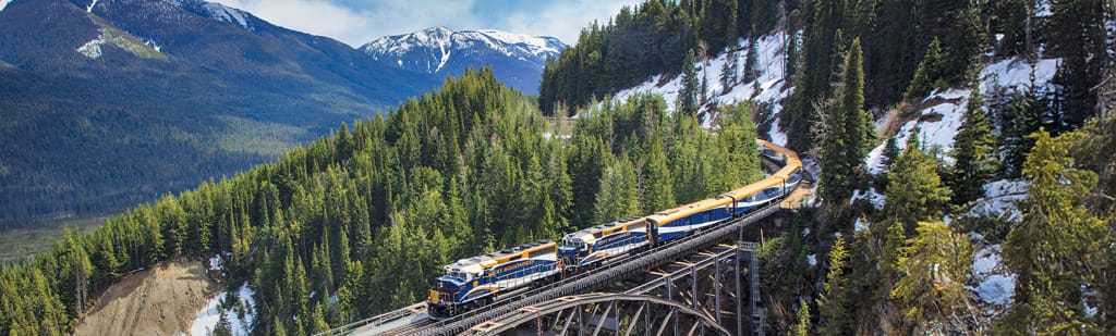 Journey on the Rocky Mountaineer  through the rugged terrain of the Canadian Rockies with a pre or post cruise land program to the Great Land.