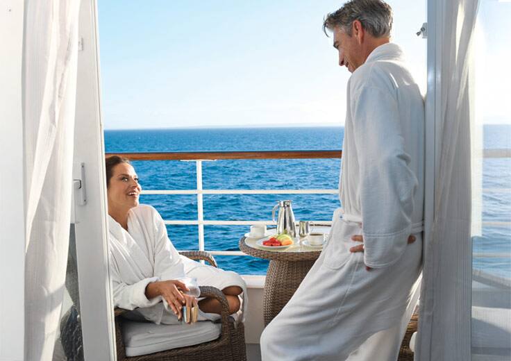 Oceania Cruises Flash Sale, couple on cruise balcony