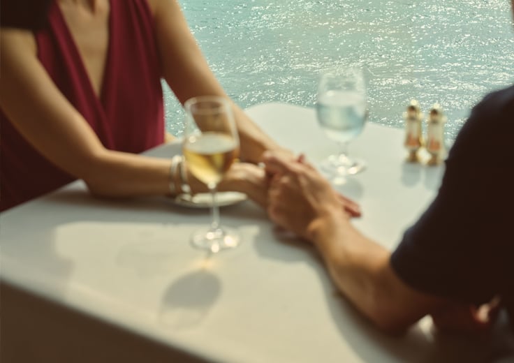 Oceania Cruises Your World Included amenities. Ladies having wine with lunch onboard at Terrace Cafe.