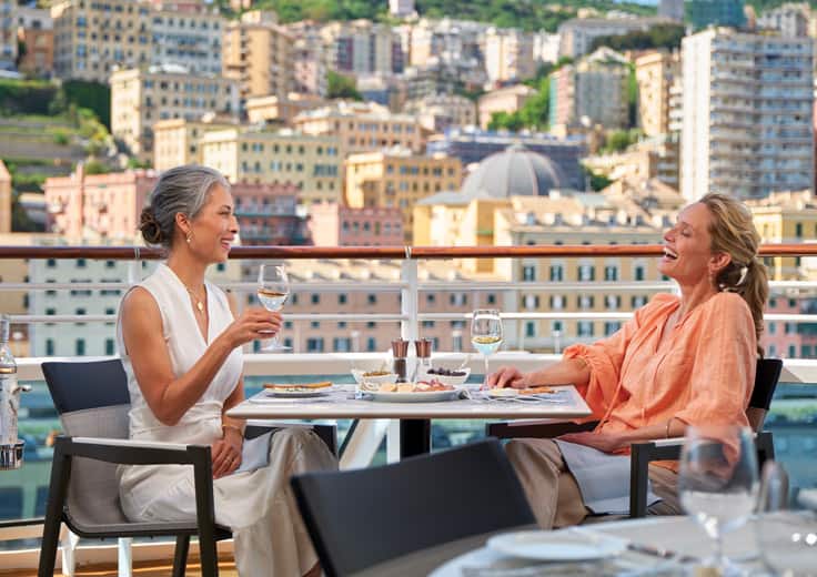 Complementary Wine & Beer on Oceania Cruises. Ladies having wine at lunch at Terrace Cafe.